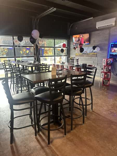 Restaurant interior with seating and balloons