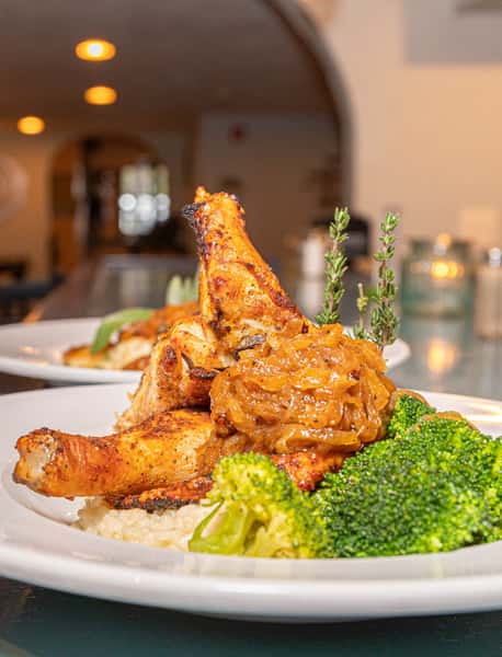 Chicken under a brick