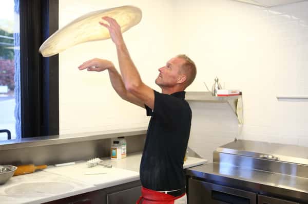 tossing pizza