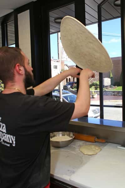 tossing pizza