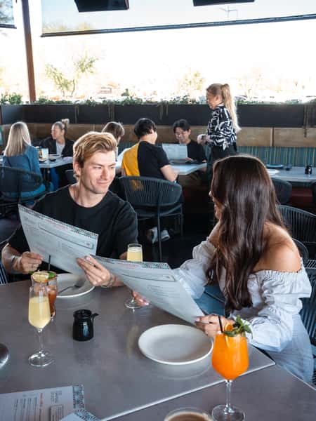 Couple looking at menus