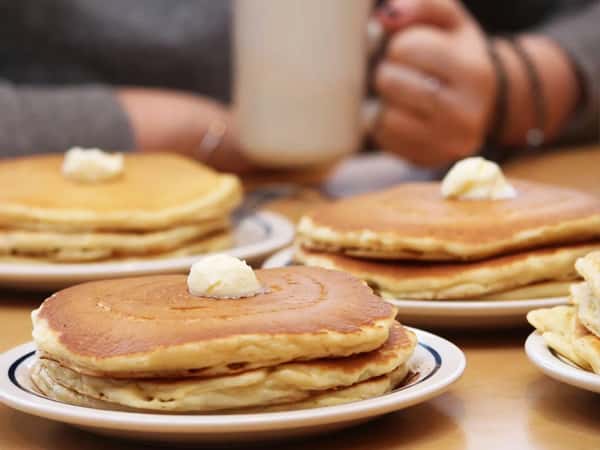 Three plates of stack of pancakes