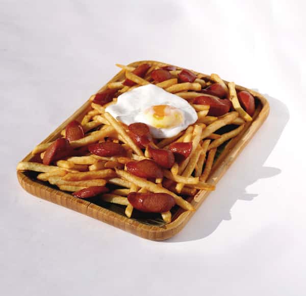 Salchipapas with fried egg