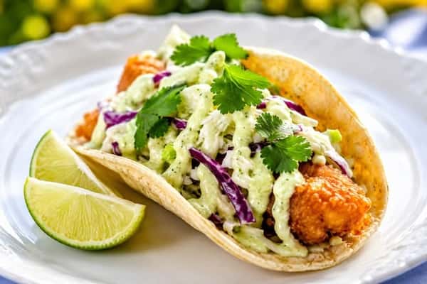 Battered fresh  Fish Taco w/ Crema Sauce and Mango Pineapple Coleslaw