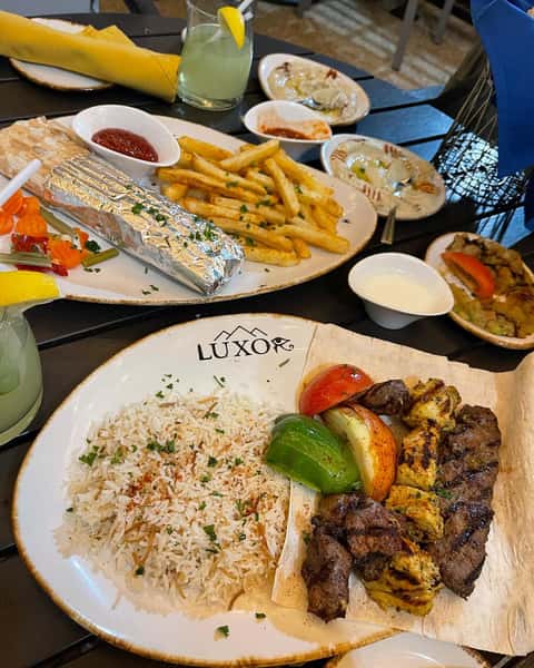 Plates of grilled Mediterranean food