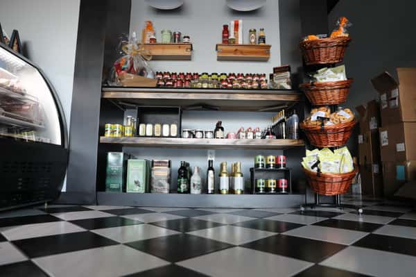 indoor deli area with dry pantry storage with stocked shelves
