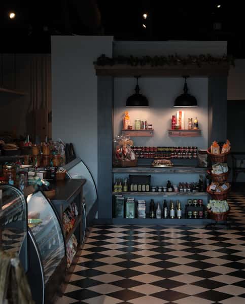 indoor deli area with dry pantry storage with stocked shelves