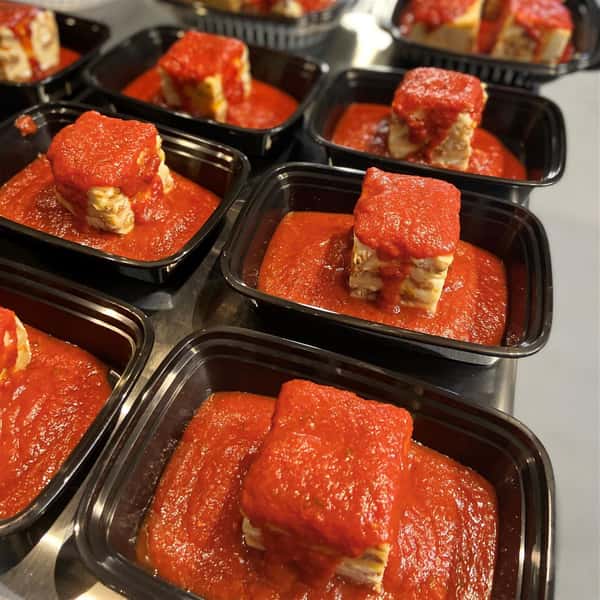 assortment of lasagnas in to-go containers