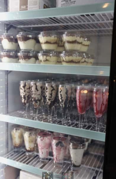 assortment of items on shelves in the fridge