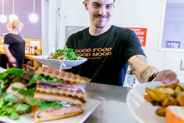 server with plates of food