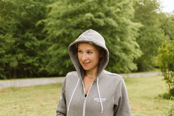 zip up grey hoodie with wordmark on left breast