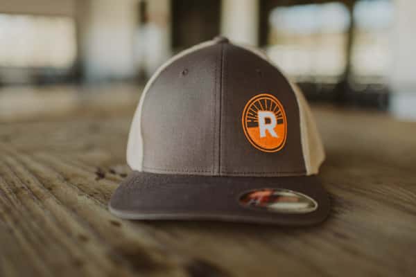 Brown Hat with orange circle R logo on left