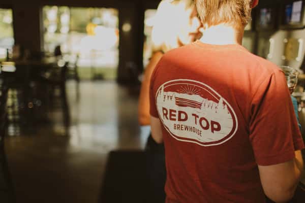Red Tee shirt with Red Top logo on the back
