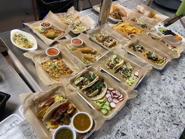 O'YA Cantina catering trays with tacos and sides