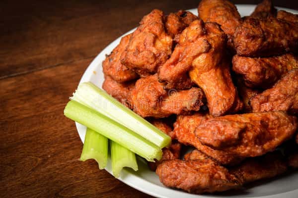 Chicken buffalo wings and celery sticks