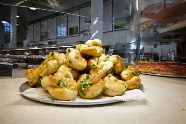 Plate of garlic knots piled up
