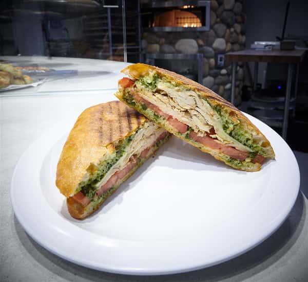 Open faced chicken panini on a plate