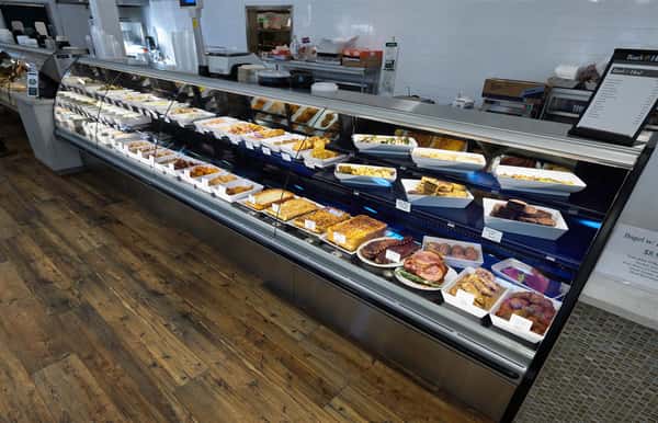 Display case of meats and precooked food