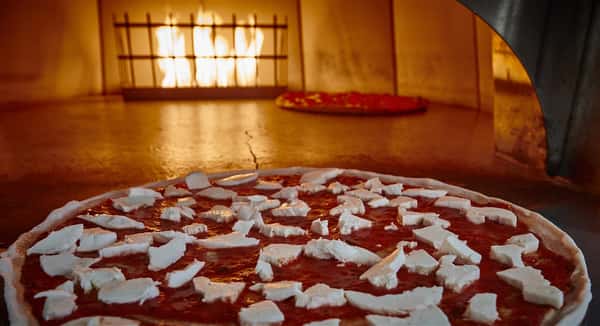 Cheese pizza about to go in the oven