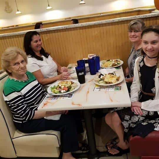 four females sitting at a booth