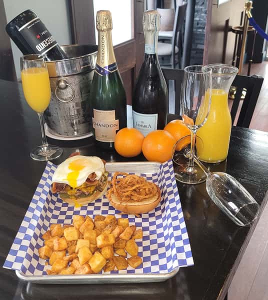 burger with home fries and mimosas