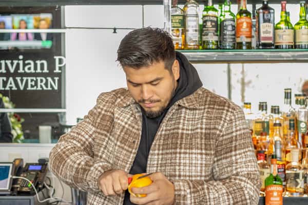 bar tender preparing item