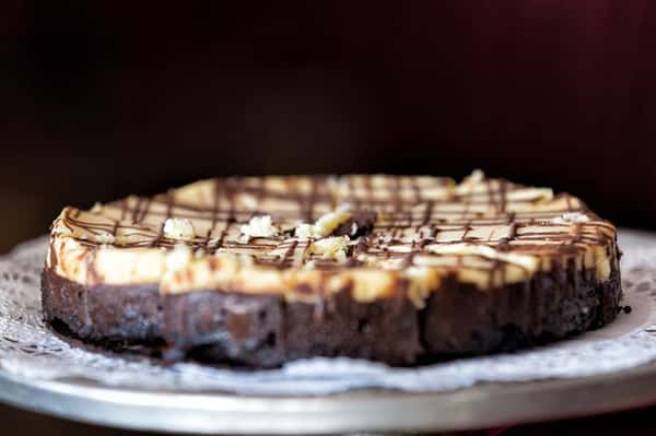 Closeup of cheesecake drizzled with chocolate and caramel