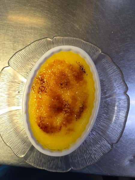 Vanilla bean crème brûlée with a caramelized sugar crust at Collectors Choice Restaurant in Snohomish.