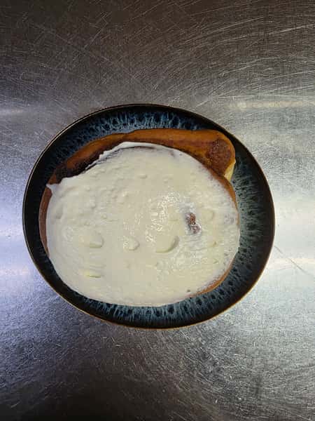 Jumbo house-made cinnamon roll with cream cheese frosting at Collectors Choice Restaurant in Snohomish.