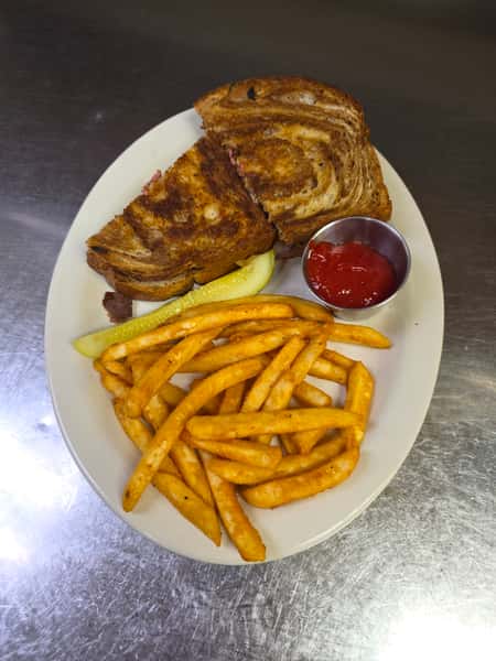 Patty melt with Swiss cheese and grilled onions on toasted rye with fries at Collectors Choice Restaurant in Snohomish.