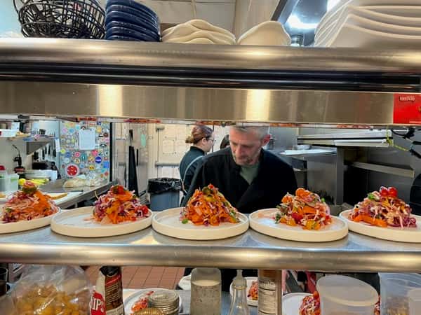 Chef Dan serving dishes