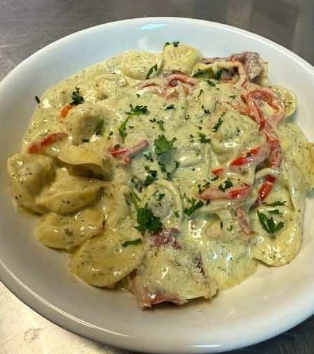 Cheese Tortellini with creamy basil pesto sauce
