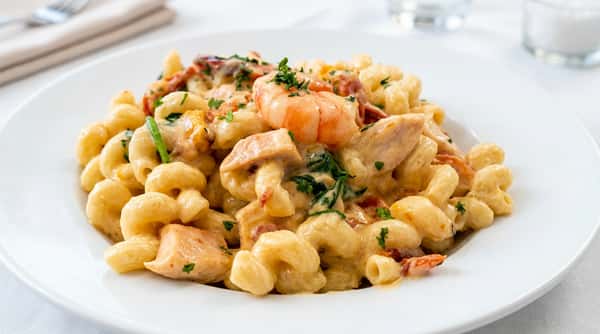 Creamy seafood macaroni pasta with shrimp and herbs at Roger's Family Restaurant in Somerset MA