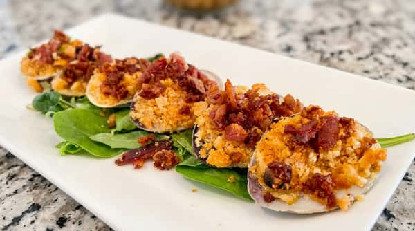 Baked stuffed clams topped with seasoned seafood stuffing at Roger's Family Restaurant in Somerset MA