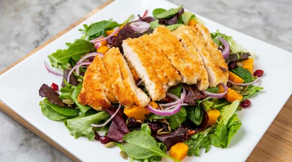 Crispy breaded chicken salad with mixed greens and fresh vegetables at Roger's Family Restaurant in Somerset MA