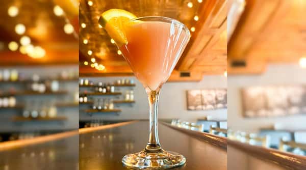 Pink specialty cocktail served in a martini glass at Roger's Family Restaurant in Somerset MA