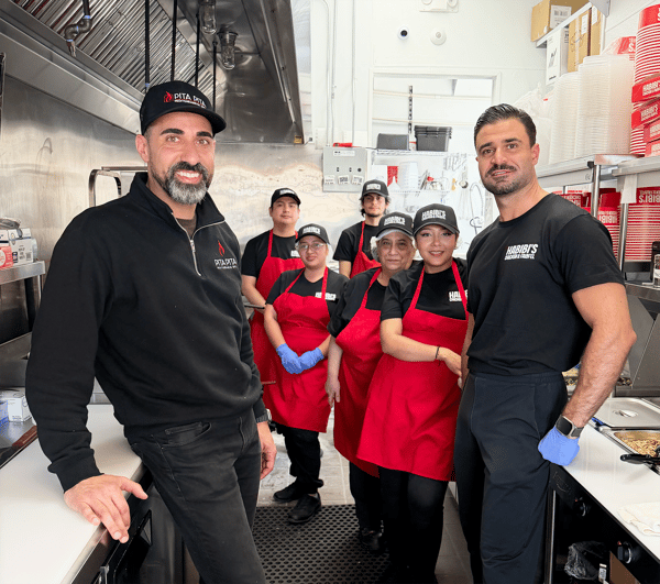 Habibi's employees standing in the kitchen