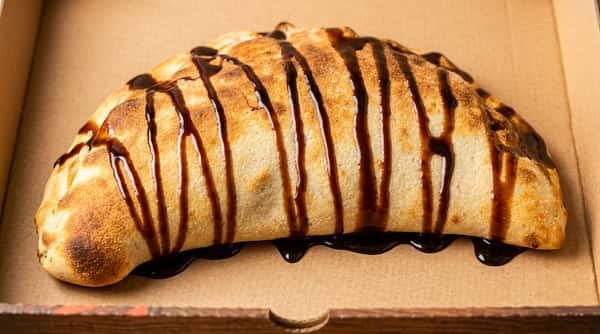 Chocolate dessert crepe at Sivas Tavern drizzled with chocolate sauce and served as a sweet brunch treat