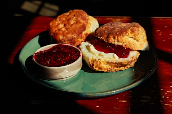 two biscuits ben's homemade raspberry jam and butter- breakfast special