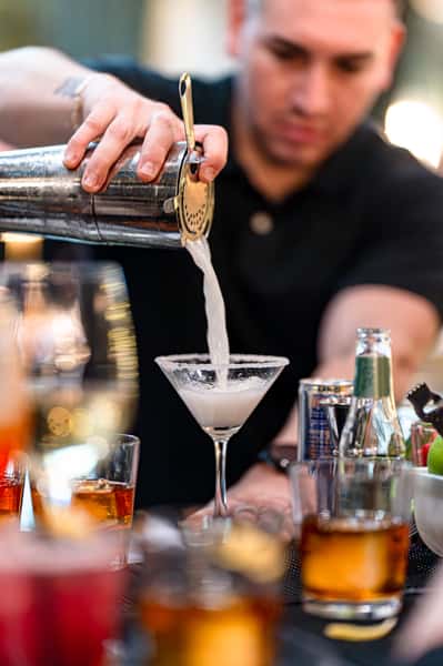 bartender pouring cocktail