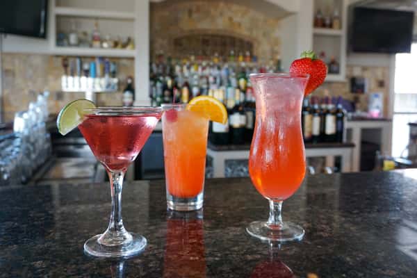 Mamma Mia's cocktails on black marble bar top with white italian marble bar