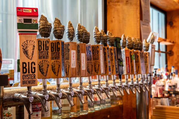 long row of Big Oyster Brewing beer taps