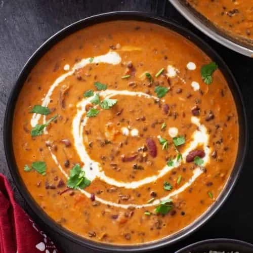 Saucy meat dish with sprinkled garnish