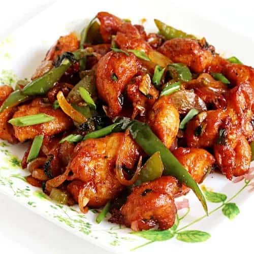 Sticky meat curry served with herb toppings