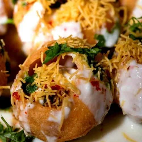 Pani puri with fillings and sauce
