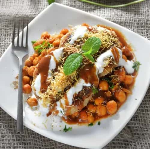 Mixed curry dish with beans, rice, and a portion of meat and potatoes