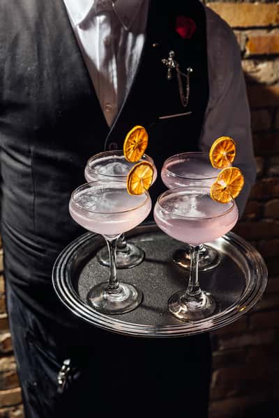 Four cocktails on a serving tray