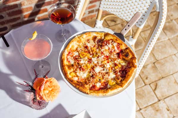 Pizza and drinks on a table