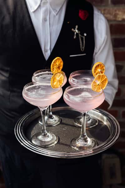 Four cocktails on a serving tray