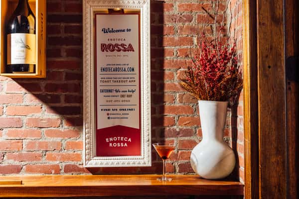 Enoteca Rossa wall sign and vase